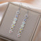 Boucles d'Oreilles Longues Symboles des 7 Chakras Argenté