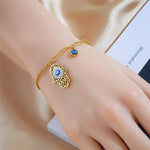 Bracelet Doré Main de Fatima et Breloque Œil Bleu - Vignette | Médiéfan
