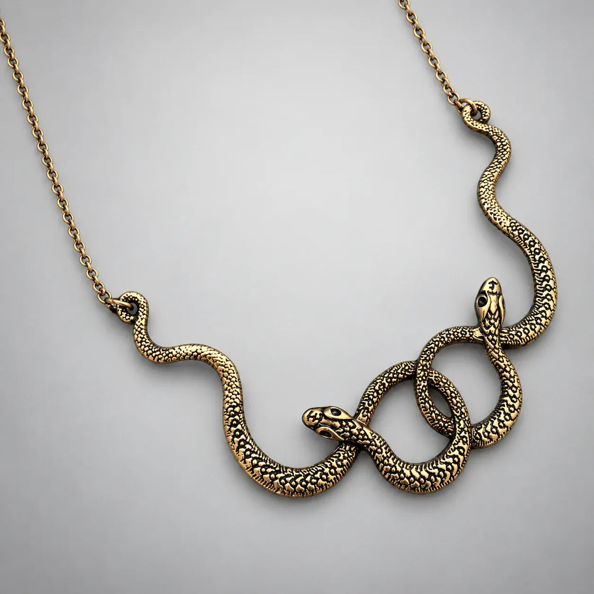 Collier Deux Serpents Enlacés Doré vieilli / 70 cm
