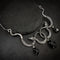 Collier Serpents Enlacés à Gouttes de Cristal Argenté & noir / 70 cm