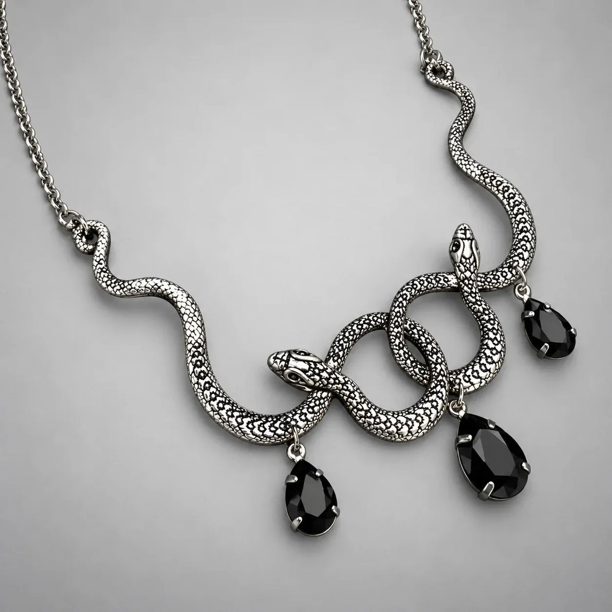 Collier Serpents Enlacés à Gouttes de Cristal Argenté & noir / 70 cm